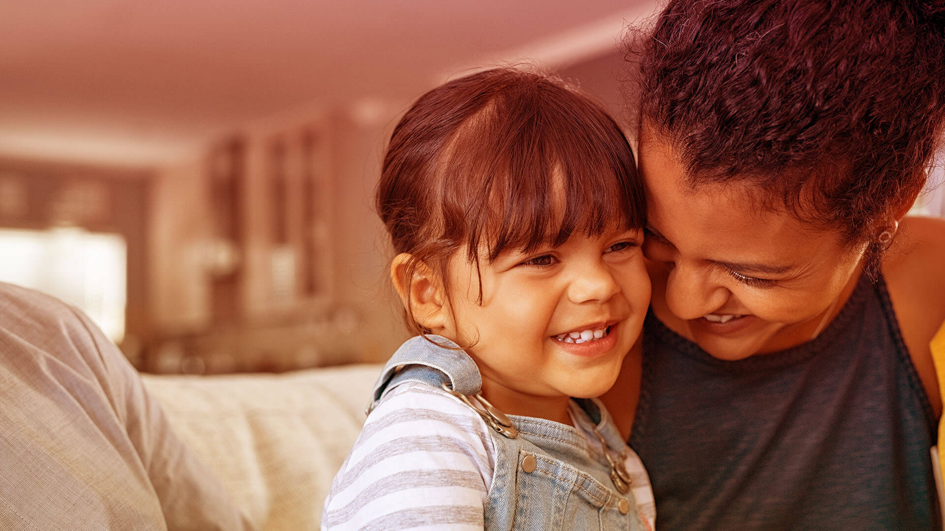 a parent laughing with her child